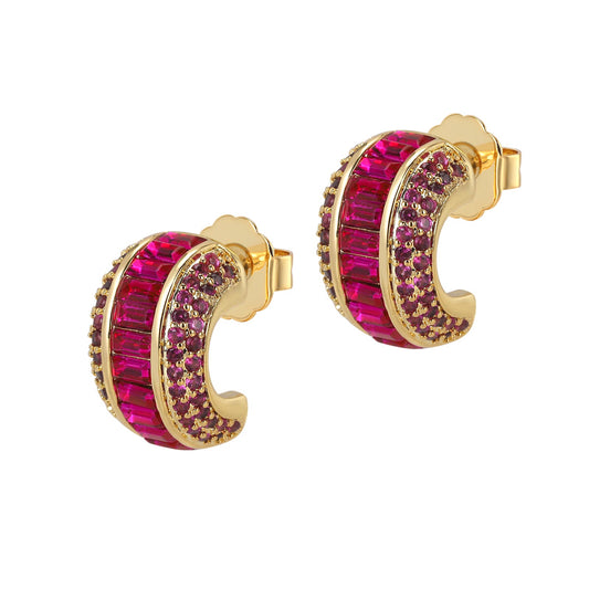 Gold hoop earrings with pink gemstones on a white background