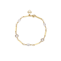 A gold chain bracelet with alternating polished round bezel-set clear crystals and elongated oval pearls, featuring a small diamond-shaped clasp engraved with the brand name 'MEME'.