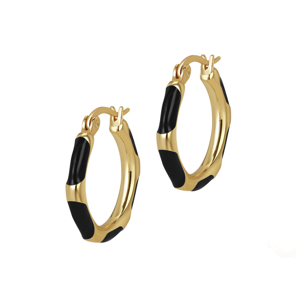Gold hoop earrings with black accents on a white background