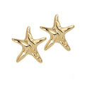 A pair of 18k recycled gold-plated earrings with a polished starfish-inspired silhouette.