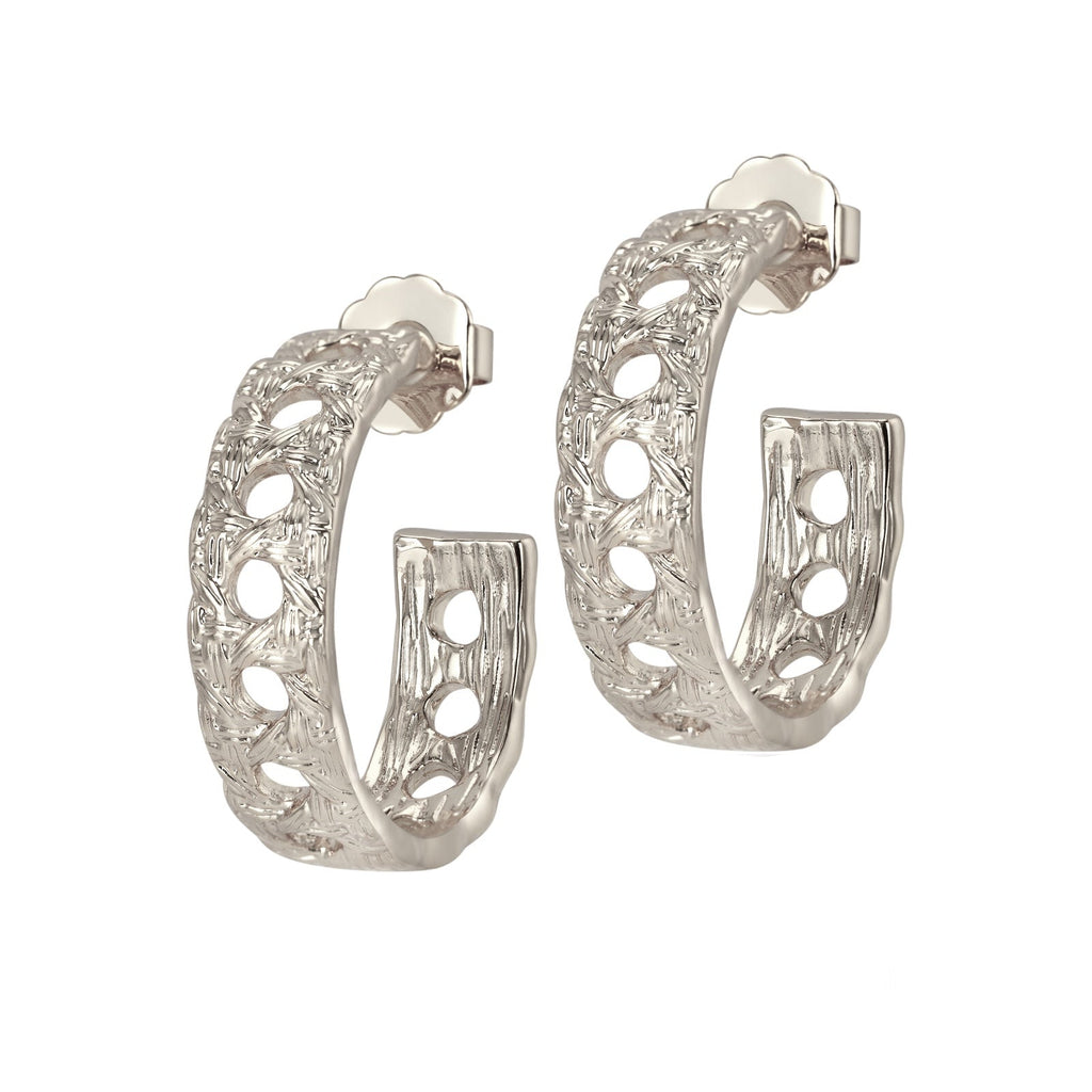 Silver hoop earrings with intricate design on a white background