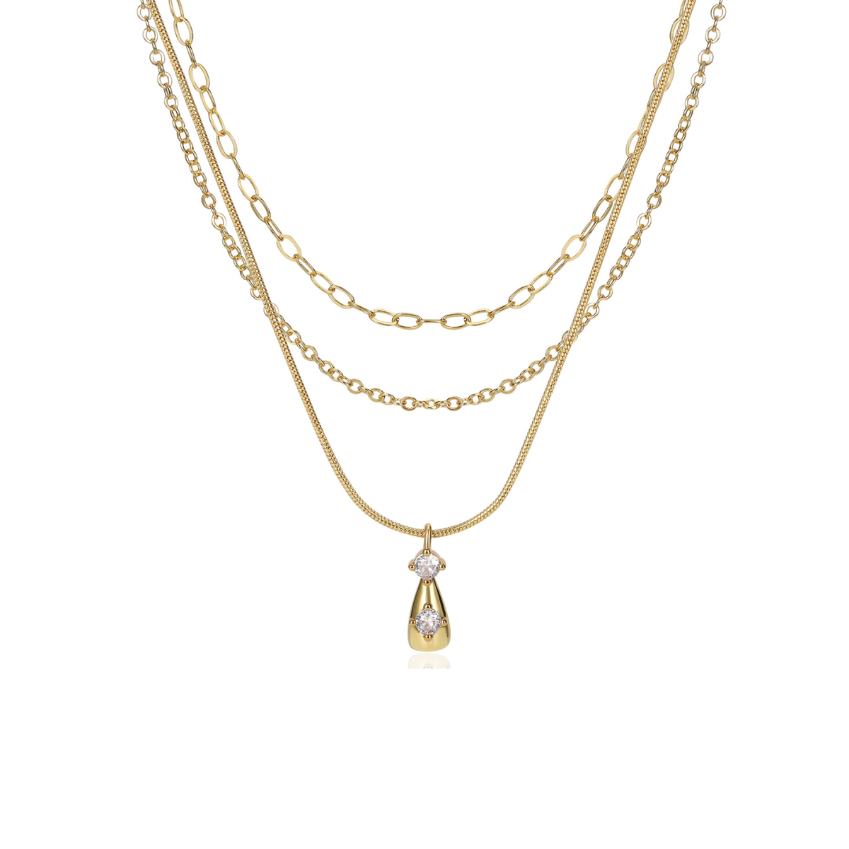 A gold layered necklace featuring three distinct chain styles (snake chain, figaro chain, and cable chain) with a teardrop-shaped pendant set with clear gemstones, shown on a plain white background.