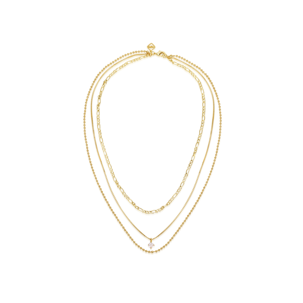 A delicate gold multi-strand necklace featuring three layered chains of varying textures, including a small clear crystal pendant, displayed on a clean white background.