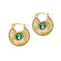 Gold hoop earrings with green gemstones on a white background