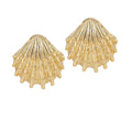 A pair of gold-plated brass earrings with a seashell silhouette design.