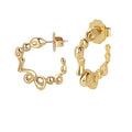 A pair of gold-plated brass hoop earrings with a textured, sculptural design, reflecting light on a white background.
