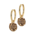 A pair of gold-colored hoop earrings with a shimmering sphere charm encrusted with warm-toned cubic zirconia, suspended from sleek hoops.