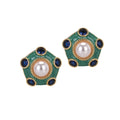 Pair of earrings with green, blue, and pearl-like stones on a white background