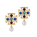 A pair of gold-plated earrings featuring a cross-shaped design with colorful resin stones and a synthetic pearl drop.
