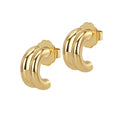 A pair of gold-colored hoop earrings with a triple-curve design, crafted from brass, displayed against a white background.