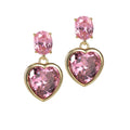 A pair of 18k recycled gold earrings with oversized pink AAA cubic zirconia set in heart and oval shapes.