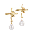 A pair of gold-plated earrings with swirl patterns and pearl drops.