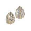 A pair of sculptural drop earrings with a textured silver-tone base and sleek gold accents.