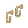 Gold hoop earrings with diamond-like stones on a white background