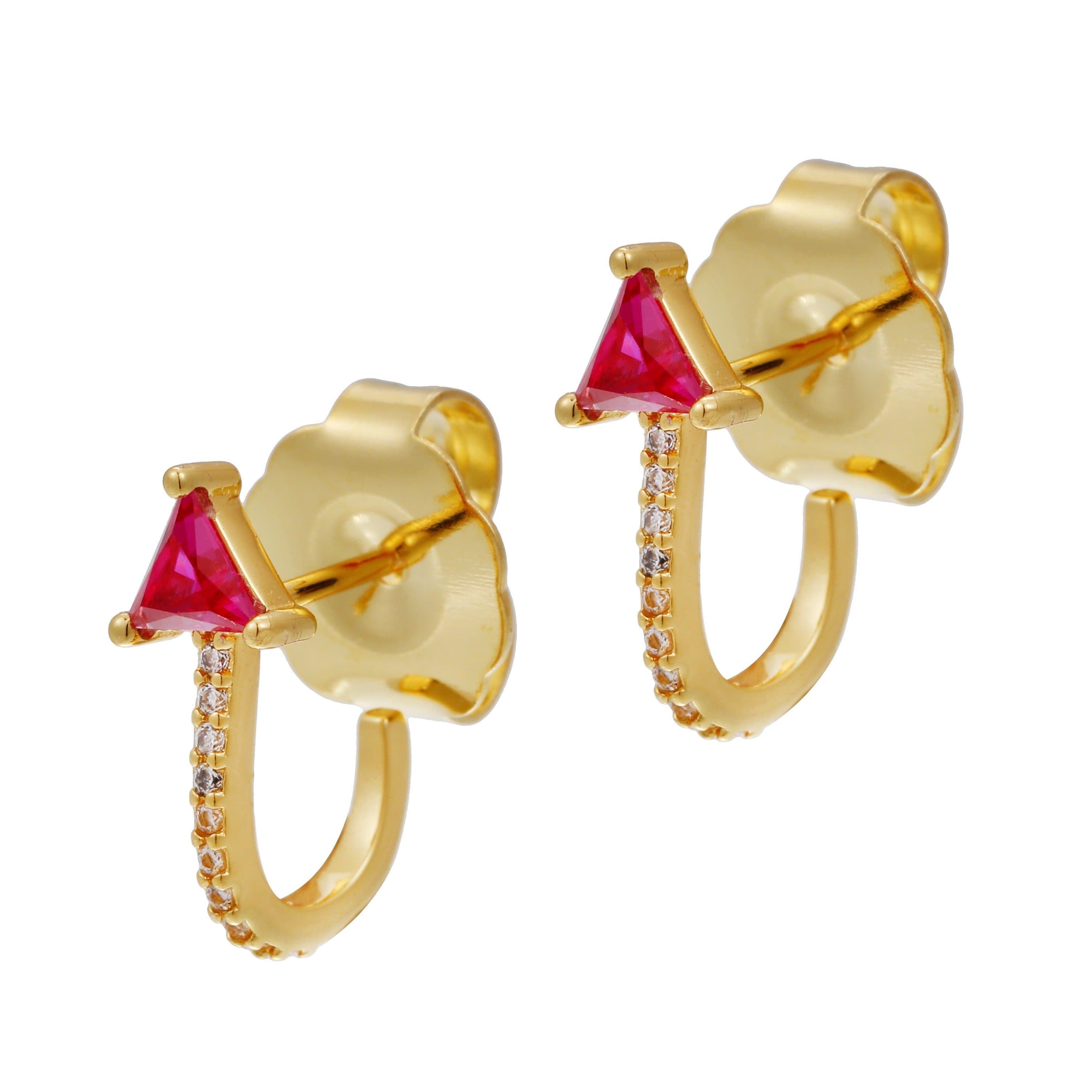 A pair of gold-colored hoop earrings with red stone accents and gold accents on the hoops.