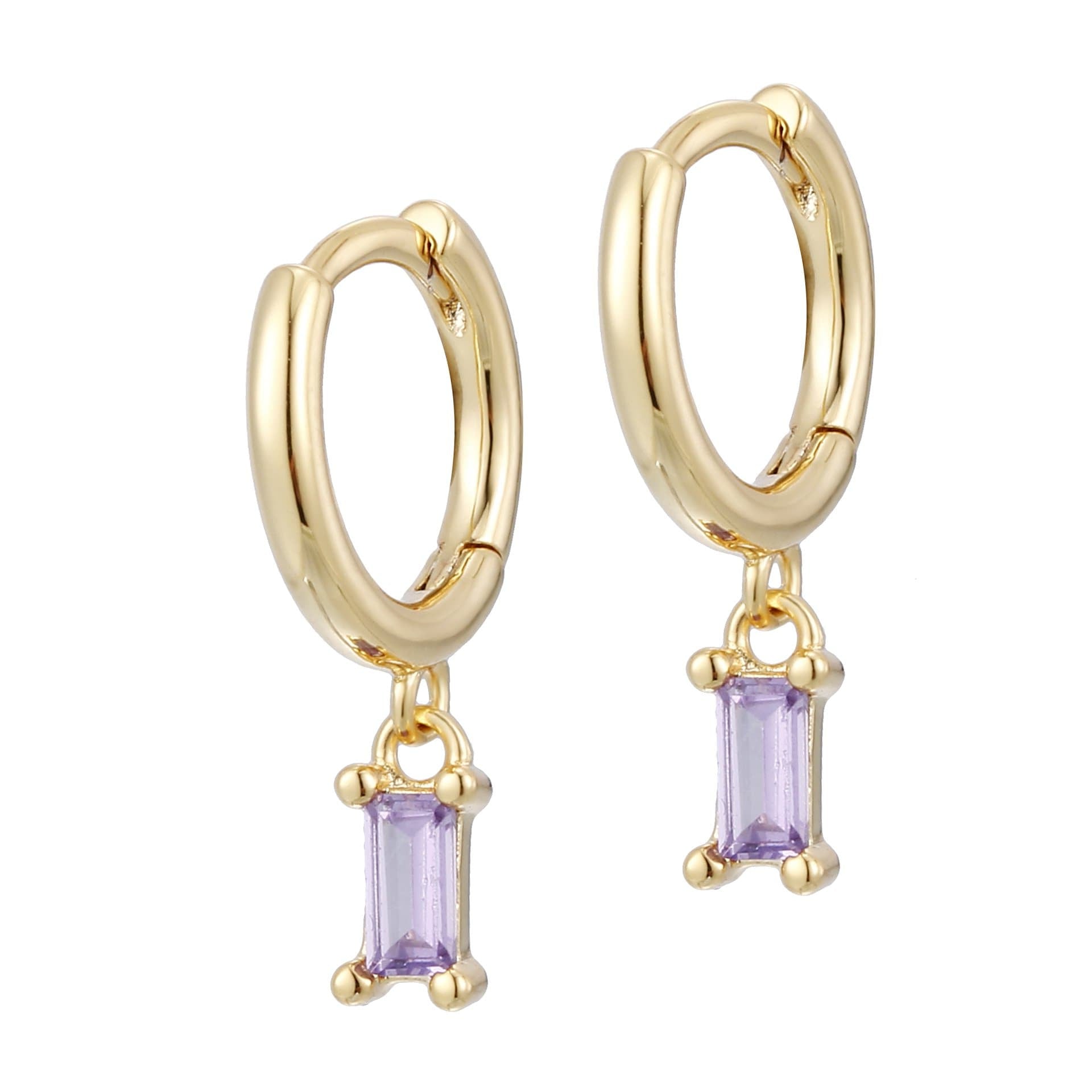 A pair of gold-colored hoop earrings with lilac stones attached to the hoops.