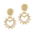 A pair of gold-colored earrings featuring a heart shape with a surrounding circle of small beads or pearls, attached to a larger textured circular finding.