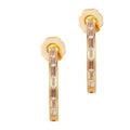 A pair of gold-colored earrings with clear crystal embellishments.